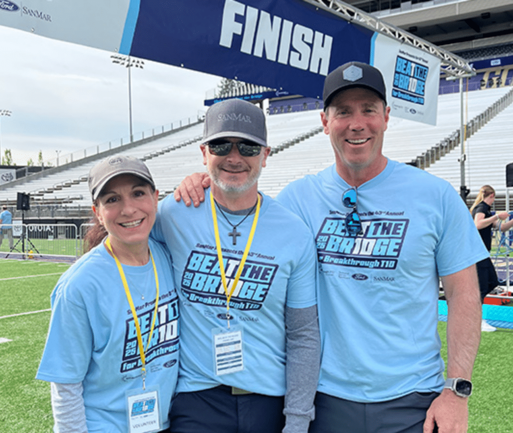 Fundraising event participants wearing branded Beat the Bridge shirts