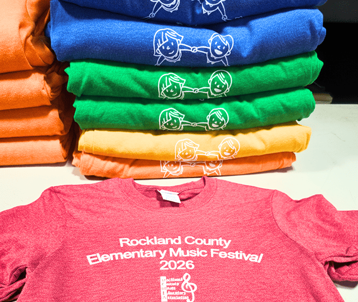 Stacked bulk custom T-shirts with Rockland County Elementary Music Festival 2025 design