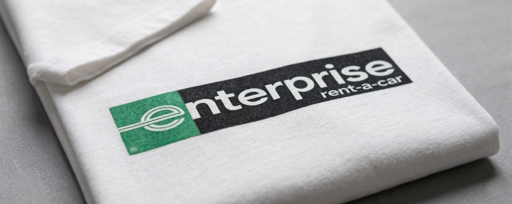 White t-shirt with Enterprise Rent-A-Car logo printed on the front.